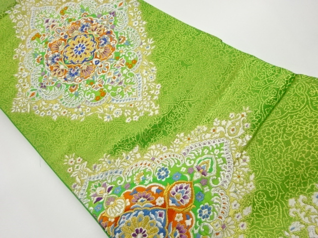 変わり華文に草花・菱模様織出し袋帯